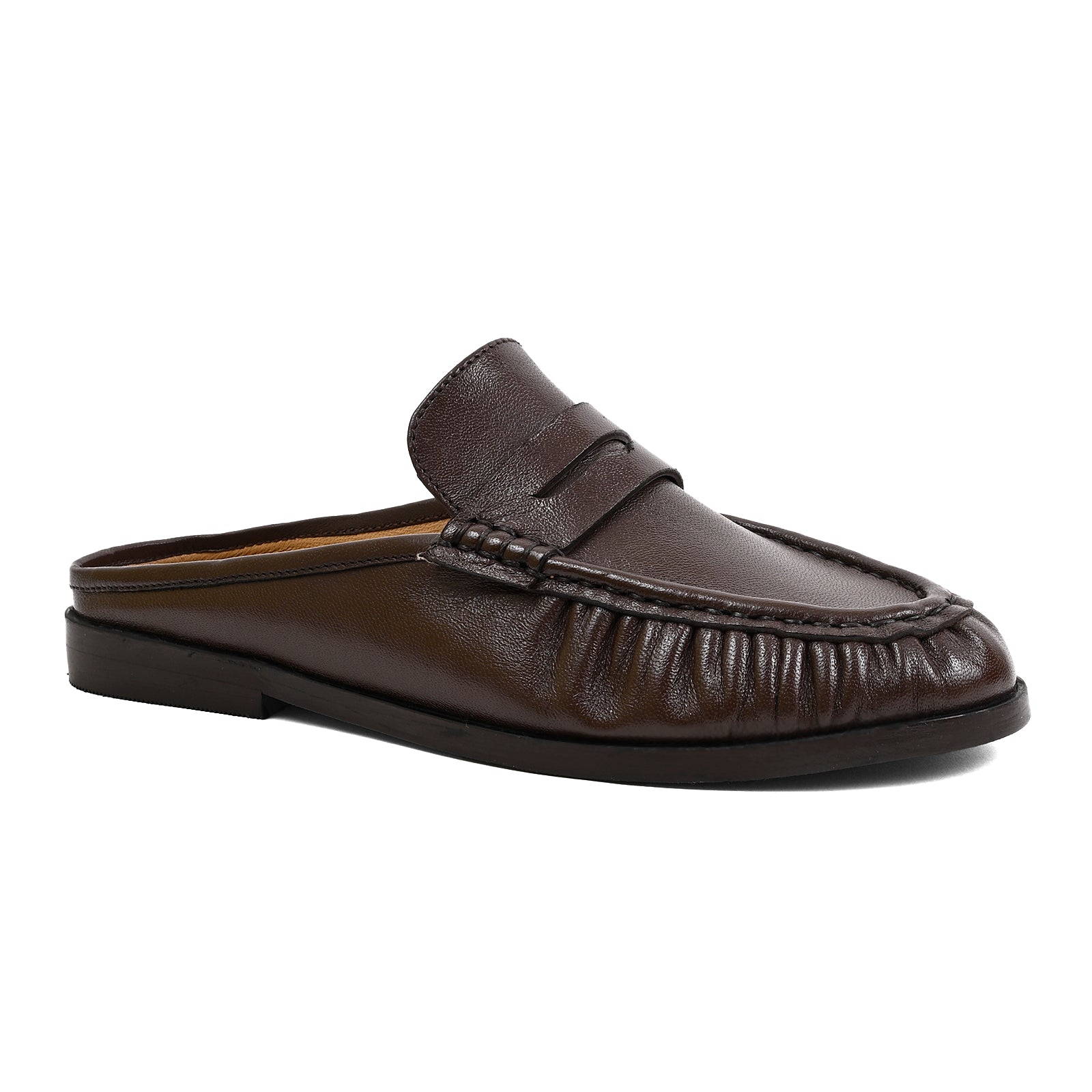 A dark brown leather slip-on loafer mule with a padded strap and gathered detailing around the toe, shown from a side profile on a white background.