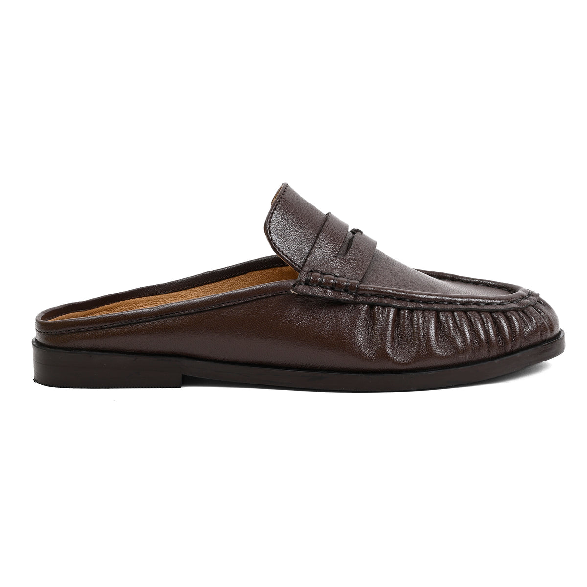 A dark brown leather slip-on loafer mule with a gathered front and a low black sole, shown in profile against a plain white background.