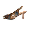 A single women's slingback high-heel sandal with a pointed toe, featuring woven brown and slate blue straps accented with gold-tone chain and metallic details, set against a plain white background.