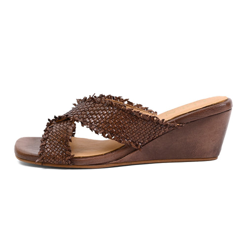 A single brown wedge slide sandal with a woven textured upper strap, shown in a side profile view against a plain white background.