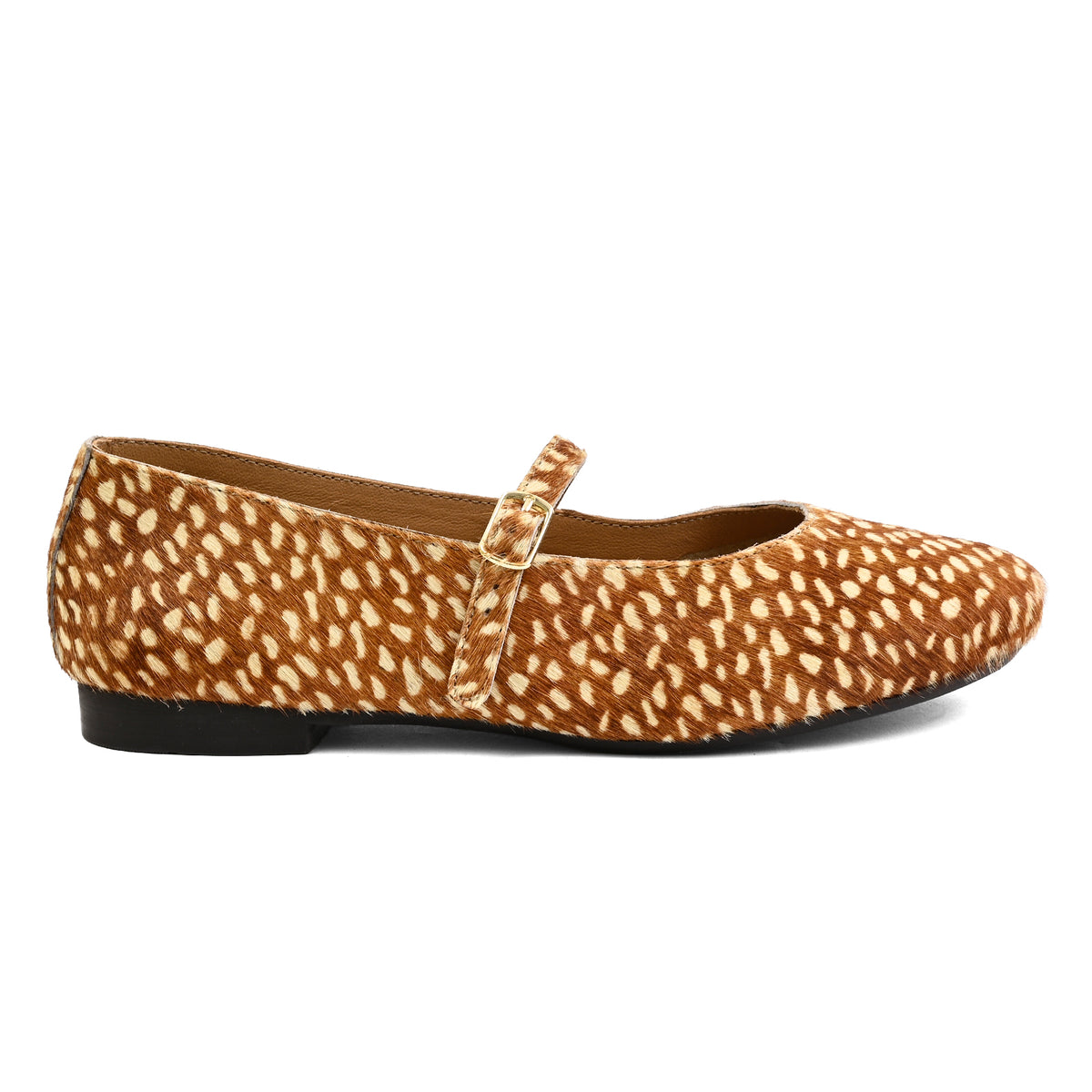 A single women's flat shoe with a brown and beige spotted animal print pattern, featuring a Mary Jane strap with a gold-tone buckle and a low black heel, shown against a plain white background.