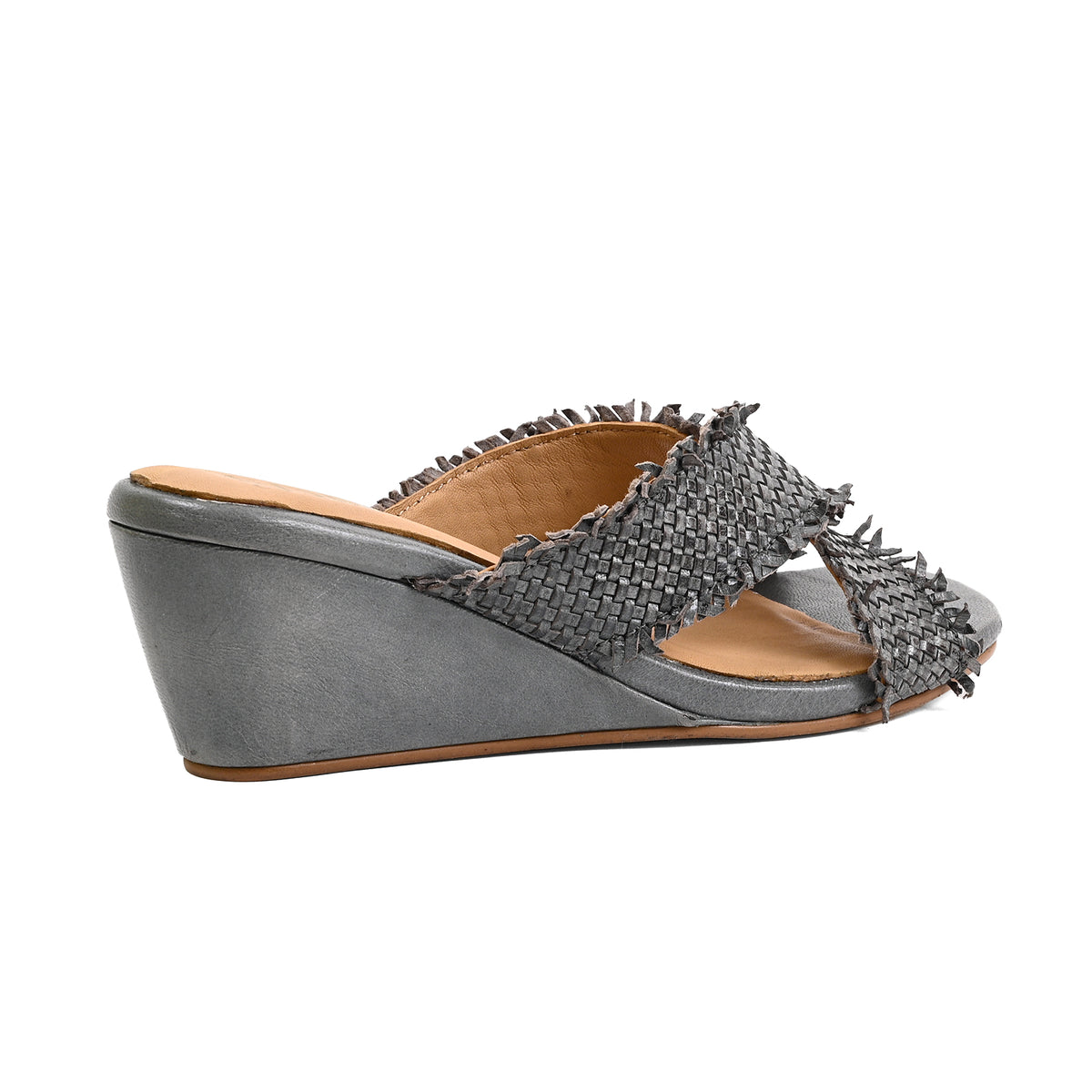 A single women's wedge mule sandal in metallic gray with a textured woven strap and fringe detailing, shown from a side profile on a white background.