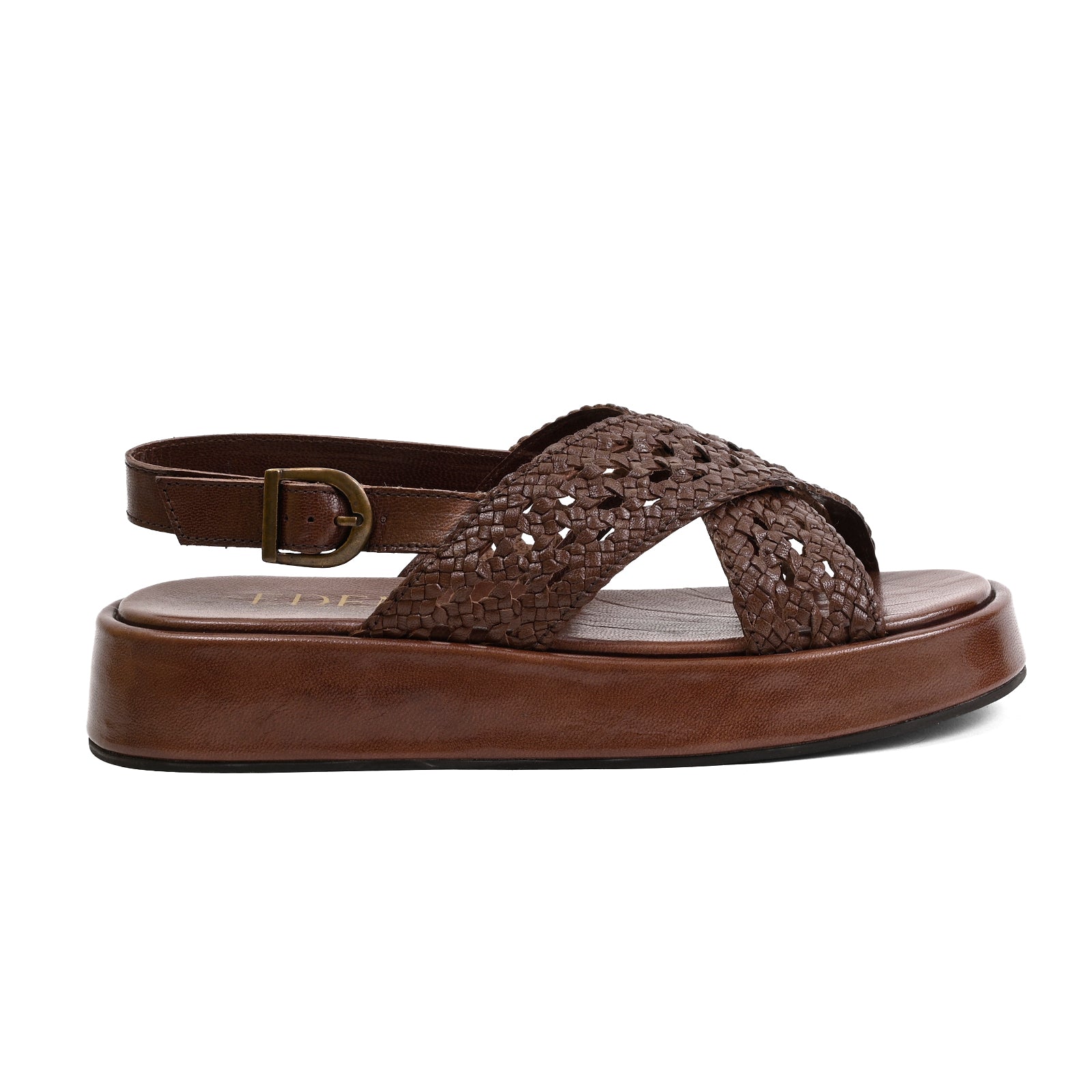 A brown platform sandal with a woven textured upper, an adjustable ankle strap with a brass buckle, and a thick brown platform sole, shown from a side profile on a white background.