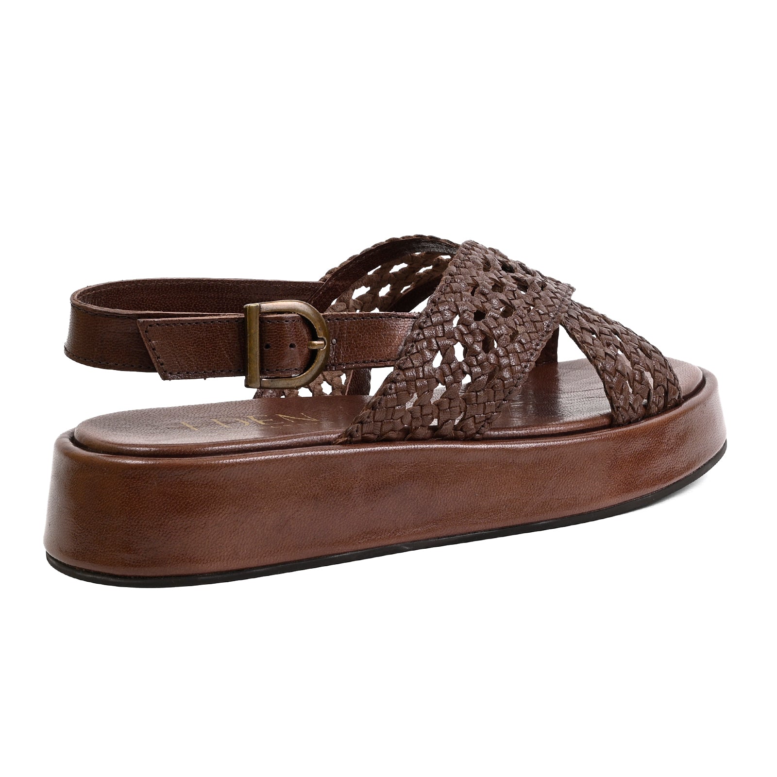 A brown leather platform sandal with a woven cutout upper and an adjustable ankle strap with a brass buckle, shown from a side profile view on a white background.